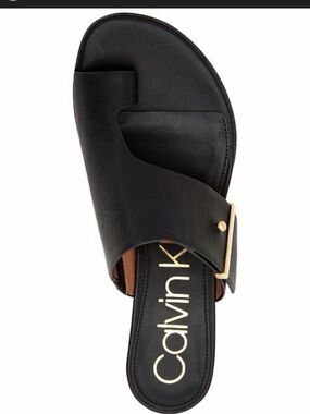 Calvin Klein  Black Leather Slide with Gold Buckle Accent